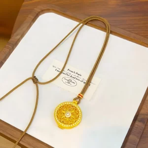 Gold Tone Openable Huang Cai Shen Pendant with Six-Syllable Mantra Design